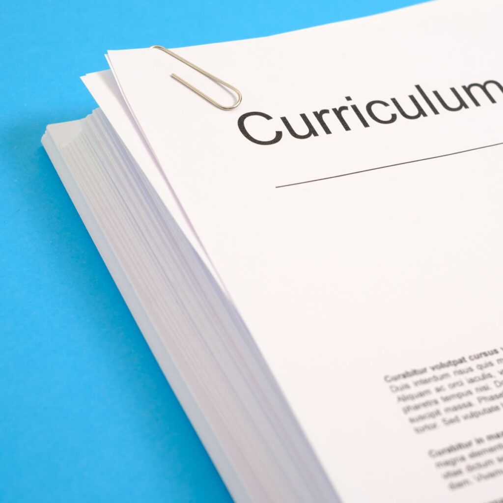 A pile of printed CVs